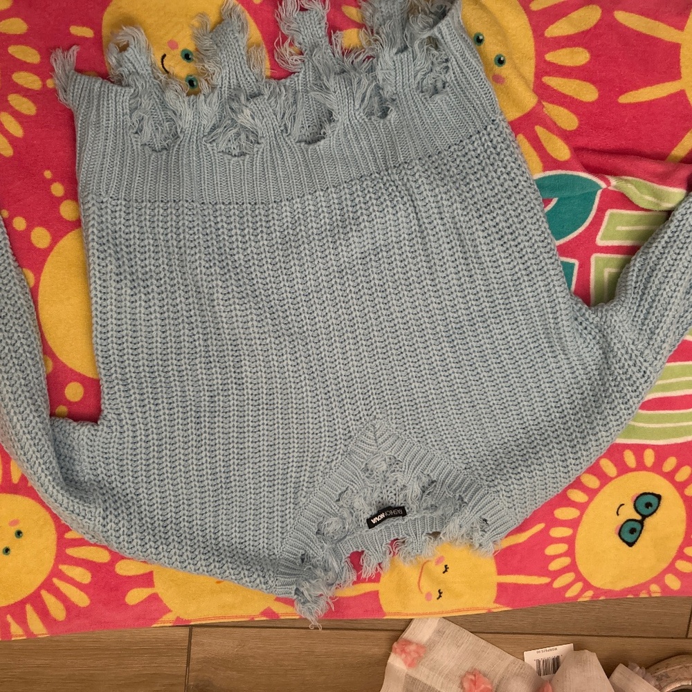 Blue distressed sweaters